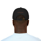 A male wearing a black baseball cap with text 'the golden pumpkin' on the back, in rusty orange color. The golden pumpkin is the store name.