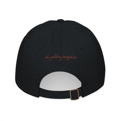 Black baseball cap with text 'the golden pumpkin' on the back, in rusty orange color. The golden pumpkin is the store name.